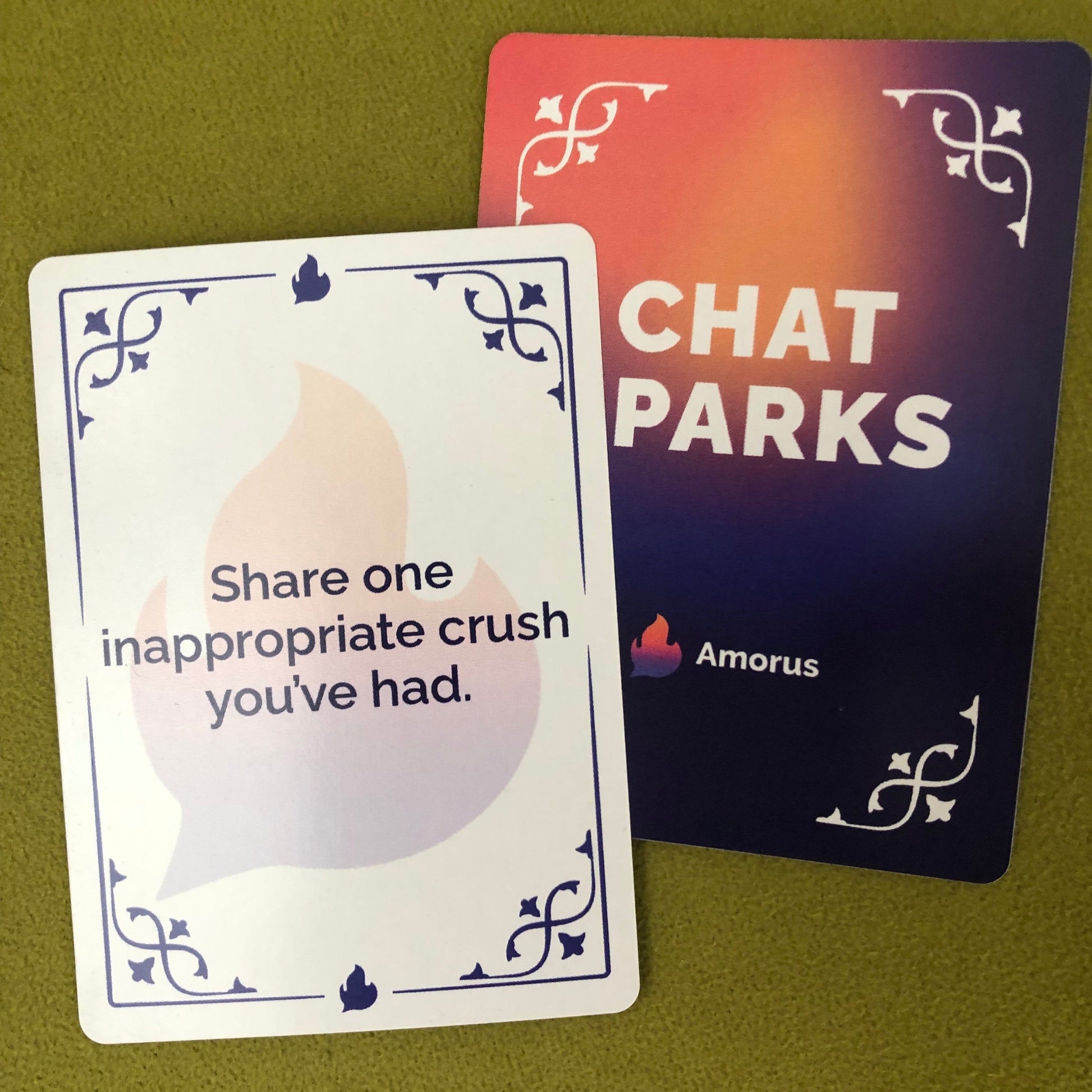 Image of Chat Sparks game card on light green felt. Card reads "Share one inappropriate crush you've had."